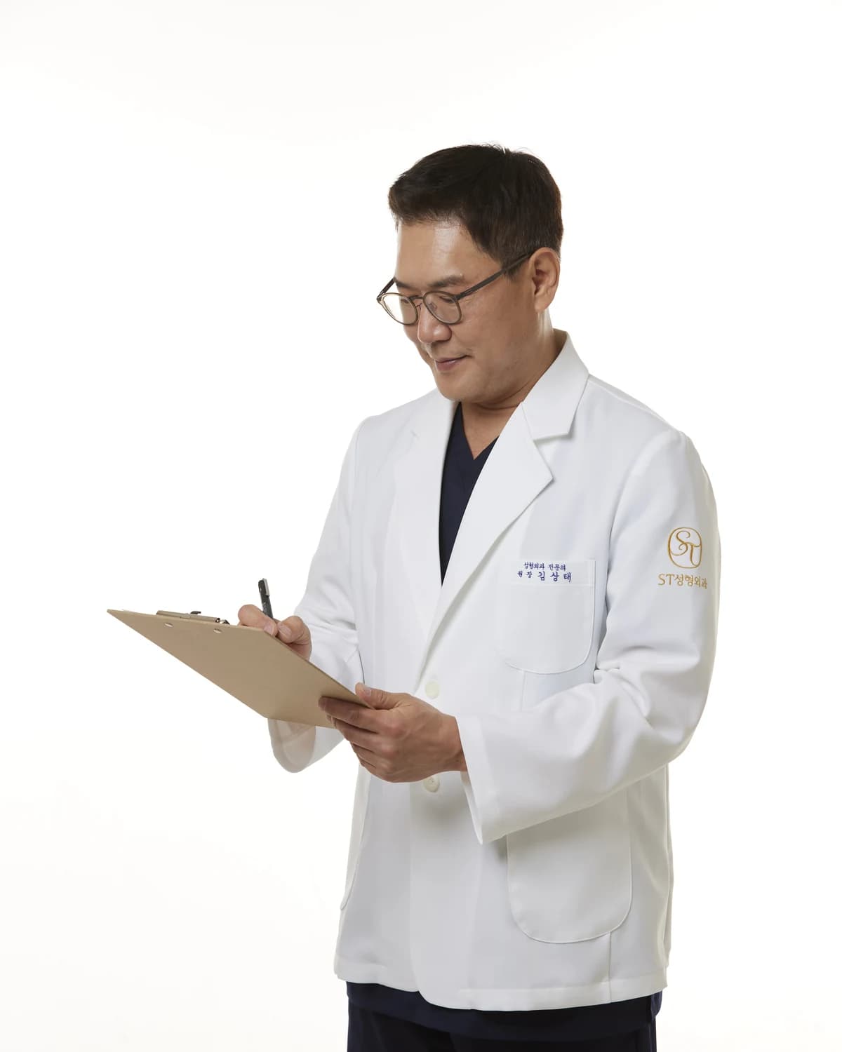 Dr. Kim Sang-tae reviewing a clinical chart in his white coat